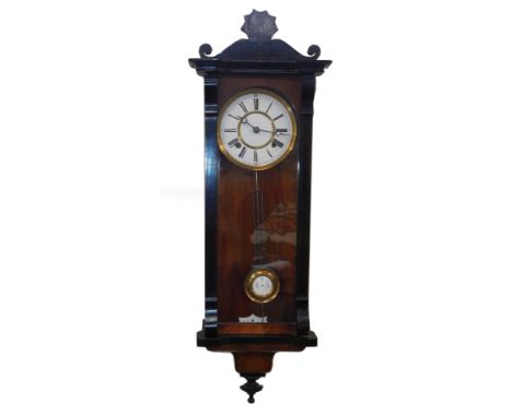 A Continental walnut and ebony cased wall clock, circular brass dial with enamel chapter ring bearing Roman numerals, eight d