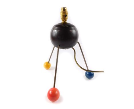 An Atomic table lamp, formed as a 'Tyrolite' bowl, raised on three metal rod legs and varicoloured ball feet, 32.5cm H.