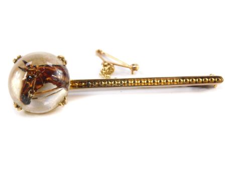 An Essex Crystal reverse Intaglio bar brooch, painted with an equine portrait, set in yellow metal, with safety chain as fitt