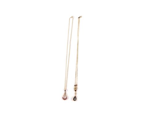 A 9ct gold garnet and seed pearl pendant on chain, and a 9ct gold ruby and diamond pendant on chain, 5.7g.