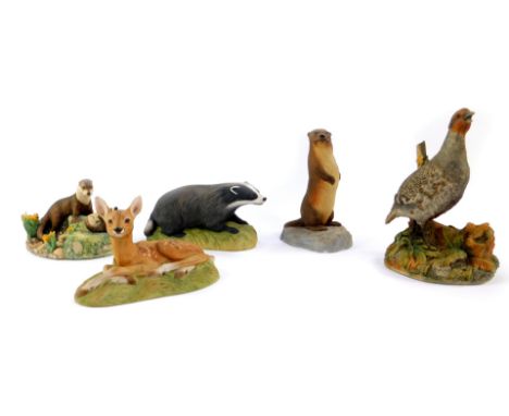 Three Aynsley bisque figures of animals by John Aynsley, 1975, comprising badger, otter, and roe deer fawn, together with a B