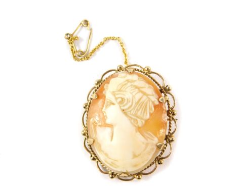 A 9ct gold and shell cameo brooch, bust portrait of a lady, with safety chain as fitted.