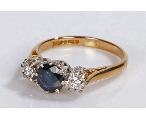 18 carat gold sapphire and diamond set ring, the central sapphire flanked by a diamond to either side, 3.4 grams, ring size N