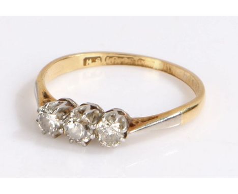 18 carat gold three diamond set ring, with three diamonds to the head, 1.8 grams, ring size K