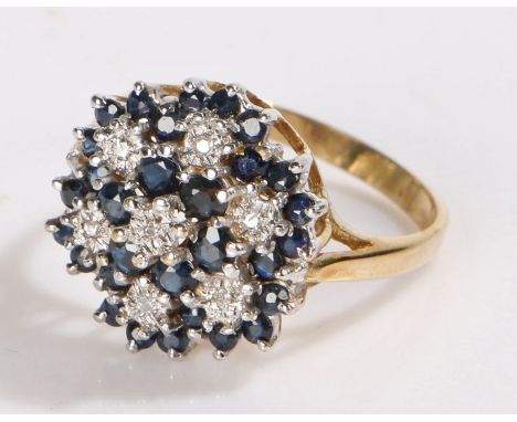 9 carat gold sapphire cluster ring, in the form of a flower head, 4.6 grams, ring size R