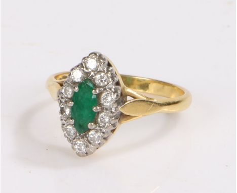 18 carat gold emerald and diamond set ring, with central naivete emerald and a diamond surround, 4.8 grams, ring size S 1/2