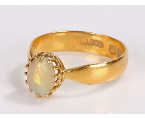 22 carat gold opal set ring, the cabochon opal with a shaped shank, 4 grams, ring size P