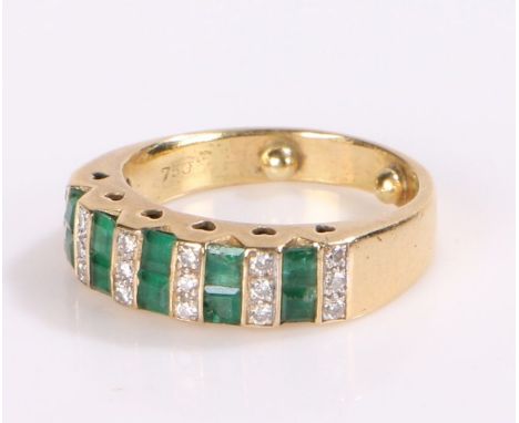 18 carat gold emerald and diamond set ring, with interspersed rows of diamonds and emeralds, 7.3 grams, ring size M