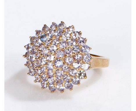 9 carat gold ring, the head set with a cluster of violet stones, 4.2 grams, ring size K