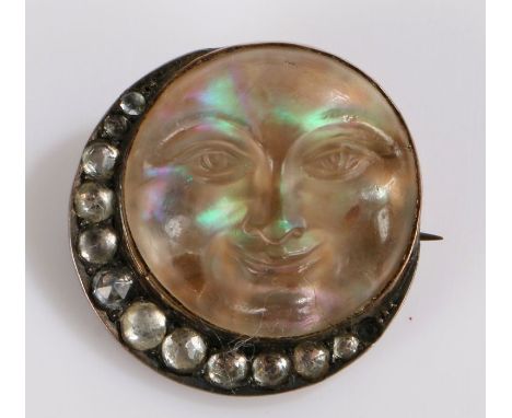 9 carat gold carved opal brooch, in the form of a face as the moon and a crescent to the side, 23mm diameter&nbsp;