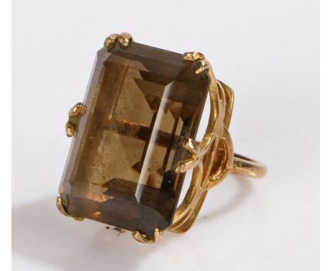 9 carat gold smoky quartz set ring, the large emerald cut smoky quartz set to six claws, 9.3 grams, ring size K