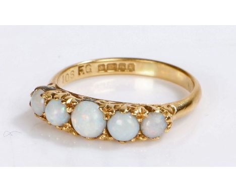 18 carat gold and opal set ring, with five cabochon cut opals to the head, 2.8 grams, ring size L