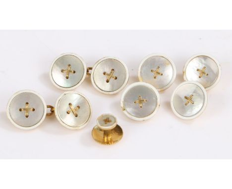 Pair of 18 carat gold backed mother of pearl button effect cufflinks, four matching dress buttons and a single collar stud, g