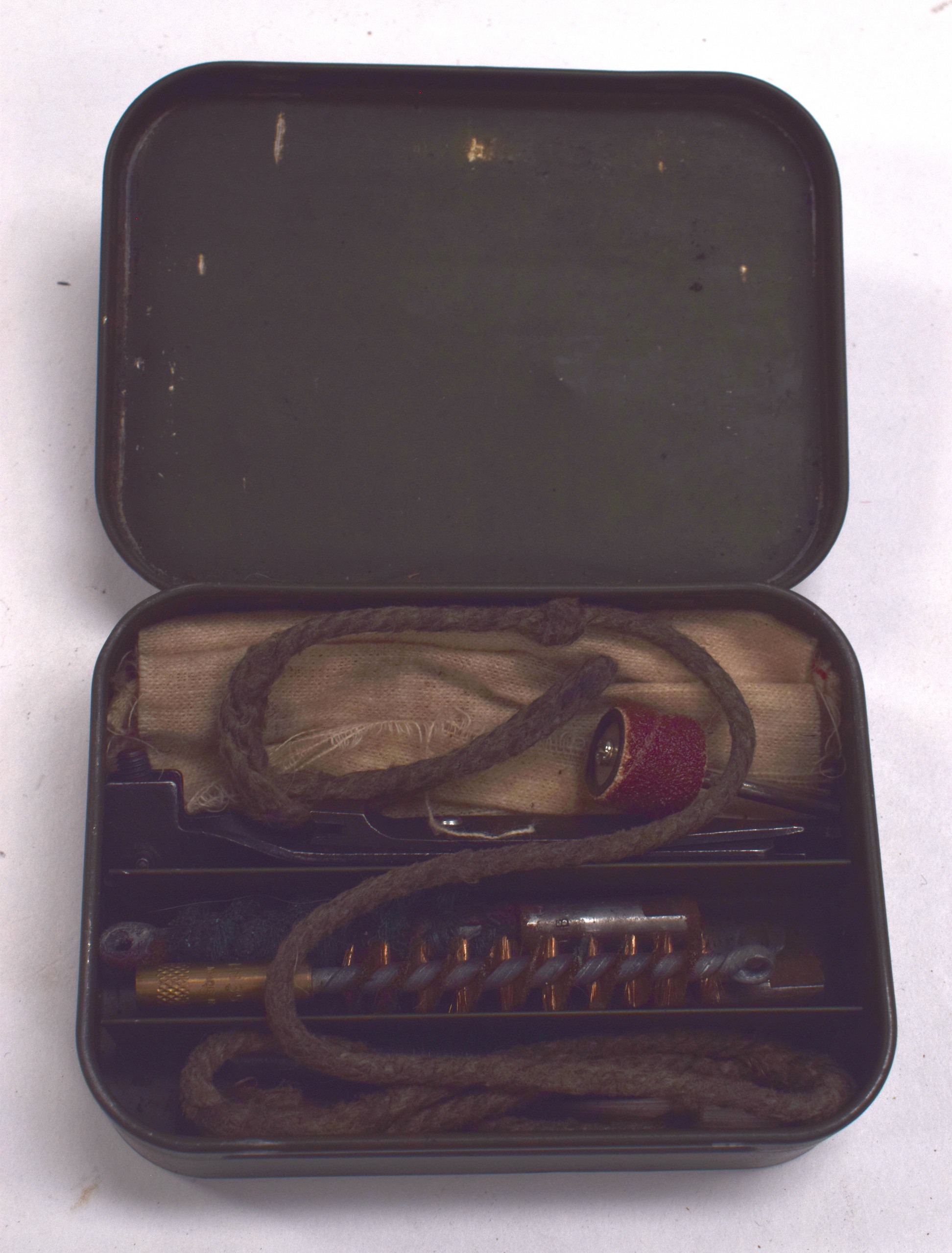 A VINTAGE GUN CLEANING KIT.