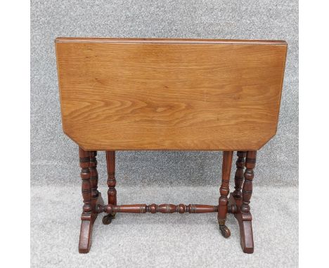 A 19th century walnut Sutherland occasional table with gate-leg action. H.55 W.15 extending to 64 D.53cm