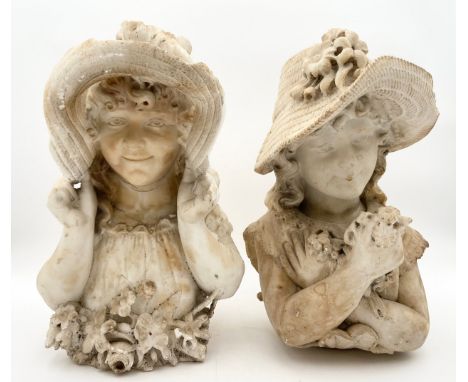 An pair of Art Nouveau alabaster busts of young girls in hats. H.41cm. (Chips and damage as seen).