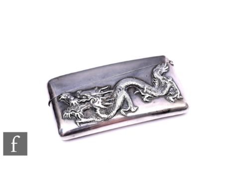 An early 20th Century Chinese silver clapperboard card case with a study of a dragon to the front, weight 61g, length 8cm, en
