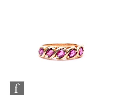 A 14ct five stone ruby ring, claw set marquise stones to plain shoulders. weight 3.5g, ring size N.