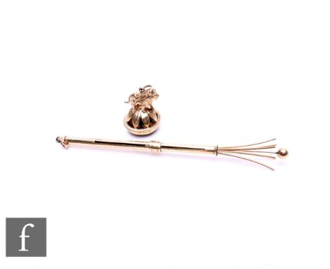 A 9ct hallmarked swizzle stick with engine turned decoration, weight 5gm length 12cm, opened, Birmingham 1971 with a 9ct moun