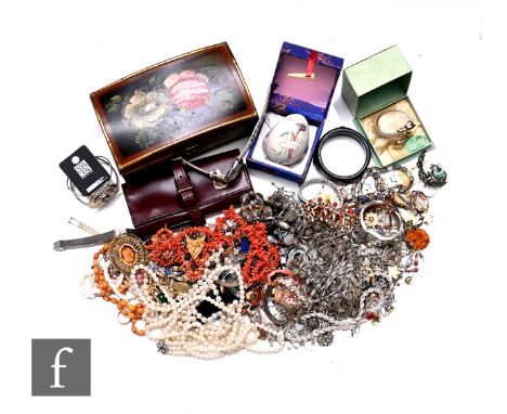 A large parcel lot of assorted costume and other jewellery to include beads, brooches, a jewellery box, watches, ring, chains