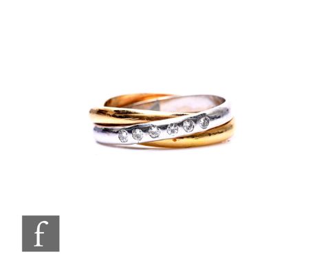 An 18ct hallmarked bi coloured twisted wedding ring detailed with five sunk set diamonds, weight 6.4g, ring size M.