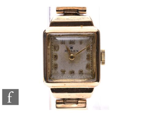 A mid 20th Century lady's 9ct Rolex manual wind wrist watch with Arabic numerals to a silvered square dial case, diameter 16m