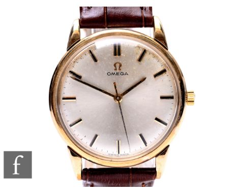 A 9ct hallmarked gentleman's Omega manual wind wrist watch, gilt batons to a silvered circular dial, case diameter 34mm, all 