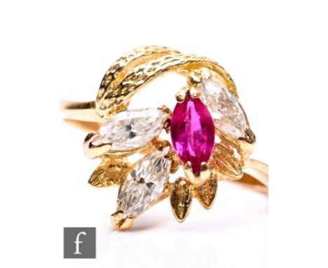 An 18ct ruby and diamond abstract ring with three marquise diamonds and a single marquise cut ruby, weight 3g, ring size K.