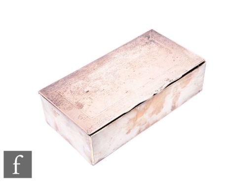 A hallmarked silver rectangular cigarette box with engine turned decoration to whole, presentation engraving to interior, len