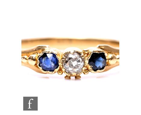An 18ct sapphire and diamond three stone ring to beaded shoulders, weight 1.5g, ring size N, unmarked.