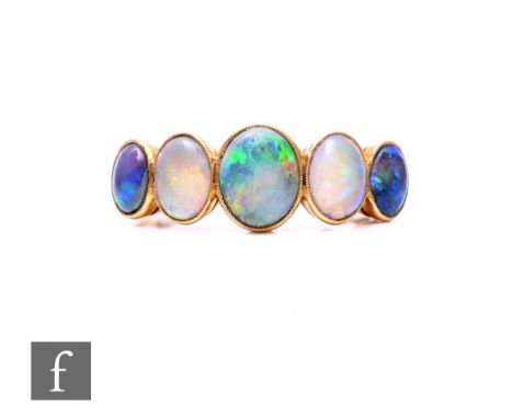 An 18ct five stone opal ring, collar set oval stone to plain shoulders, weight 3.7g, ring size T.
