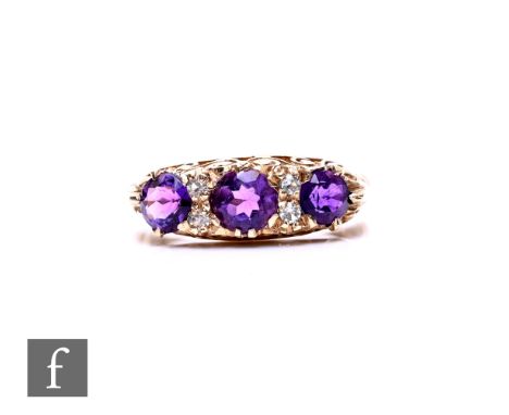 A modern 9ct hallmarked amethyst and paste Victorian style seven stone ring, weight 3g, ring size O.