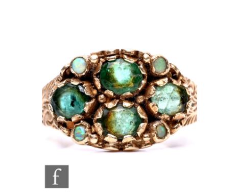 A 9ct hallmarked emerald and opal cluster ring, four central emeralds with opal detailed borders, weight 3.3g, ring size O.