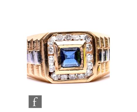 A 14ct sapphire and diamond cluster ring, central collar set square sapphire within a diamond border, weight 7g, ring size T.