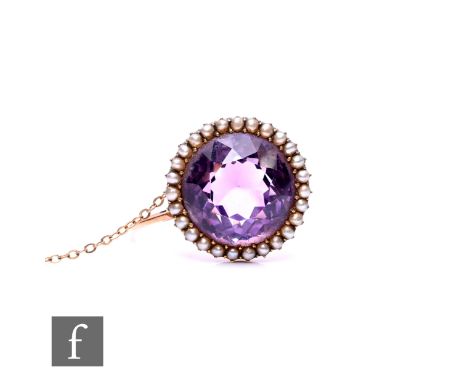 A 19th Century 15ct amethyst and seed pearl brooch with central amethyst, weight 6.6g, diameter 20mm.