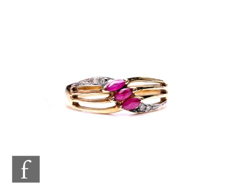 A 9ct hallmarked ruby and diamond ring, three marquise rubies flanked by diamond to a split head, weight 3g, ring size N.