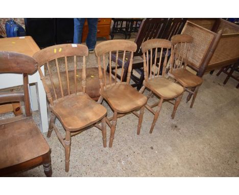 A set of four Victorian elm seated and stick back kitchen chairs
