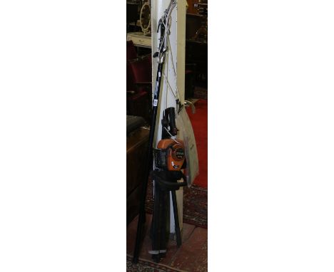 A Tanaka THT2100 petrol hedge trimmer, two pairs of tree loppers and a telescopic tree lopper.