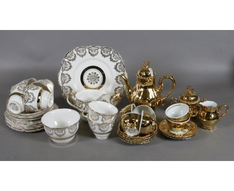 A Bondware gold lustre six place porcelain coffee set along with a DuBarry part tea service with 22 ct gold decoration.