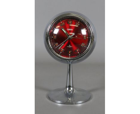 A 1950s chrome effect pedestal Coral alarm clock with metallic red dial. 
