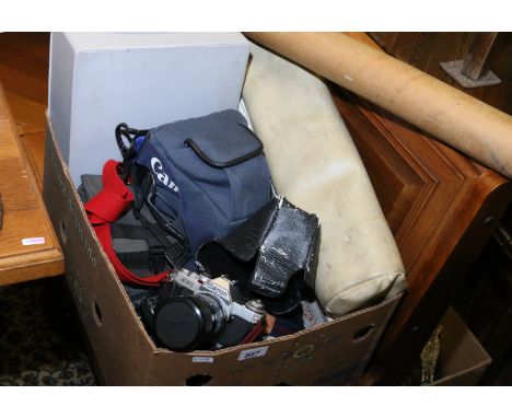 A box of photographic equipment to include roller slide projector, screen, Canon T90 35mm with various lenses, Canon E0S 1000