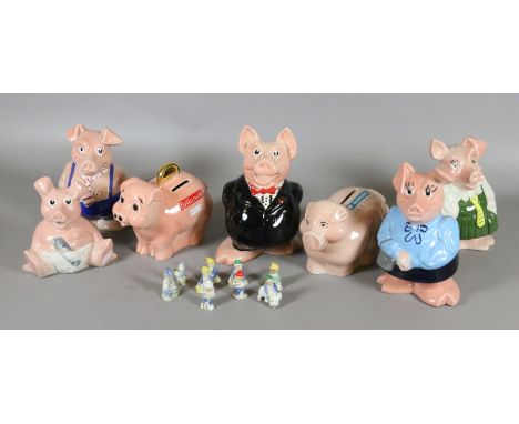 Seven Wade piggy banks for NatWest, Barclays and Britannia along with a collection of Wade gnomes.