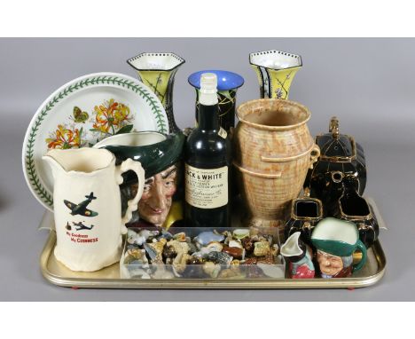 A tray of pottery and china including Royal Doulton character jug, Wade Whimsies, Bells jug and a Black & White Scotch Whiske
