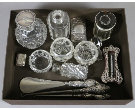 A lot of silver mounted items to include a Continental snuff box, a Georgian vinaigrette, a perfume bottle, dressing table se