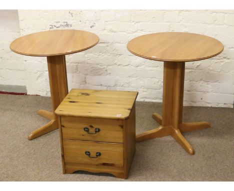 A pine two high chest of drawers and a pair of light oak occasional tables.
