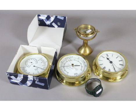 Two modern wall barometers and a wall clock along with a brass compass and a novelty wristwatch.