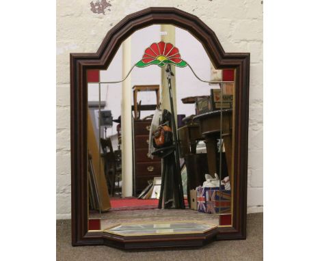 A framed leaded glass arch topped hall mirror with shelf.