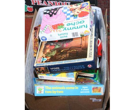 A box of childrens toys and board games.