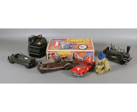 A boxed Arxon Evel Knievel Chopper toy, a clockwork monkey, a Japanese tinplate fire chief car, a squeeze box, two model vint