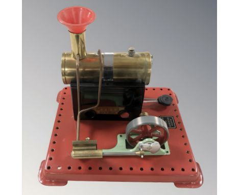 A Mamod live steam boiler with piston.